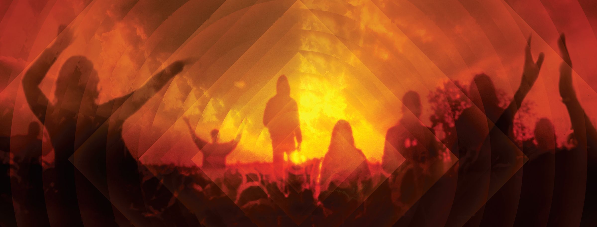 Silhouetted crowd with arms raised against an orange sky, from the Glastonbury The Movie poster
