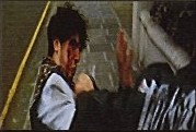 Frame from The Punk: a fight on a stairwell