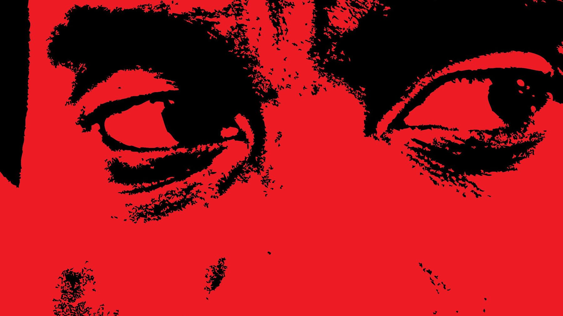 A man's eyes in black on red, from the Sus poster