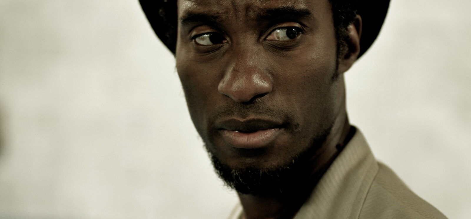 Clint Dyer as Delroy, close-up