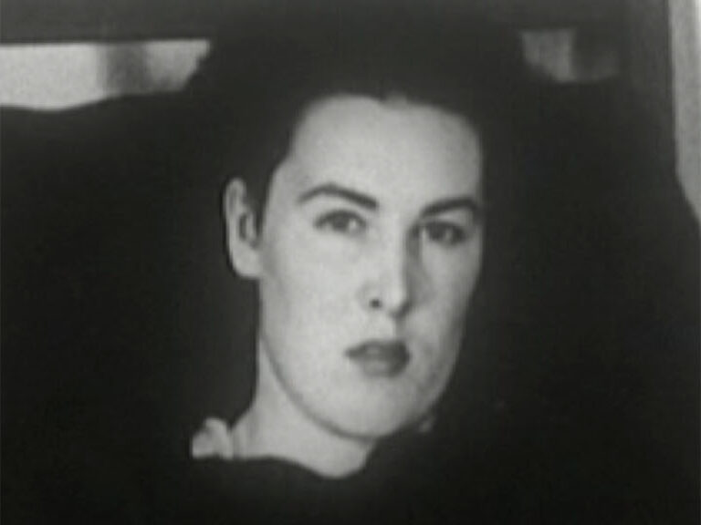 Black and white portrait of a woman staring into the lens